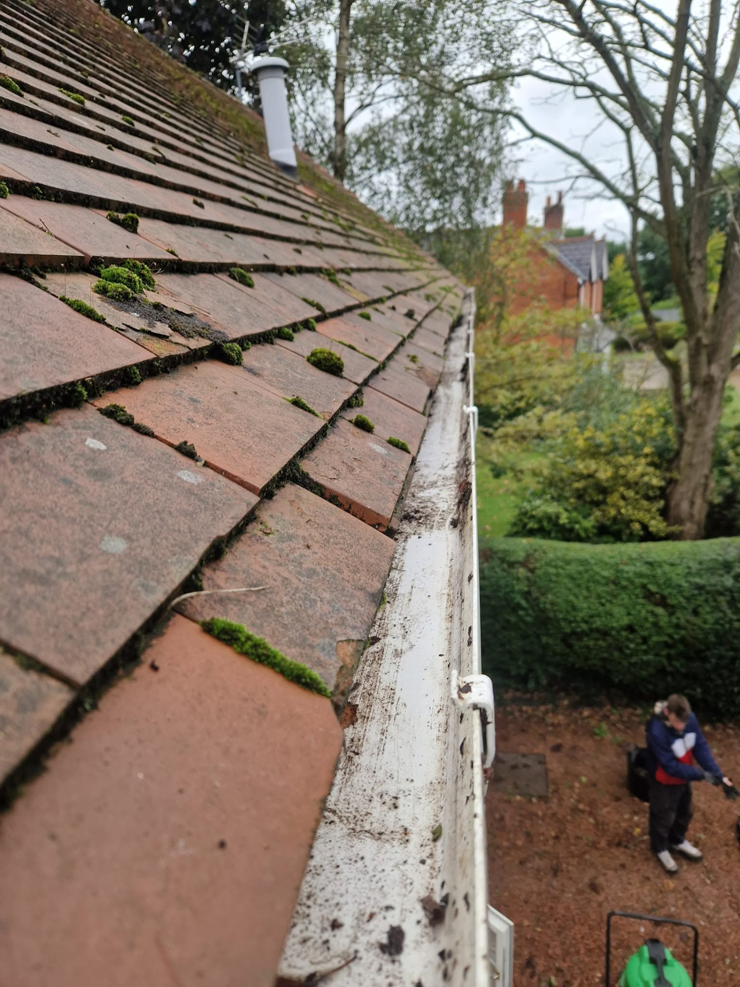 Moss removal and soft wash roof cleaning on a tiled roof in Redditch, Worcestershire